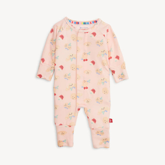 Light pink baby sleeper with pancakes and other bakery items with magnetic closure.