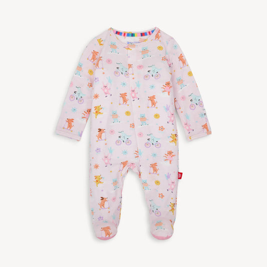 Light pink baby onesie with colorful animal print and magnetic closure.